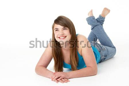Stock photo: Studio Portrait Of Happy Teenage Girl