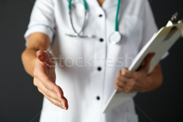 American nurse extending hand to shake Stock photo © monkey_business