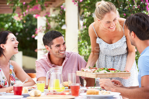 Group Of Friends Enjoying Meal outdoorss Stock photo © monkey_business