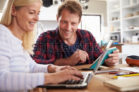 Stock photo: Teacher Helping Boy To Use Digital Tablet In Computer Class