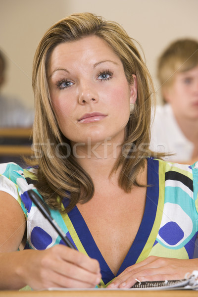 Female college student listening to a university lecture Stock photo © monkey_business