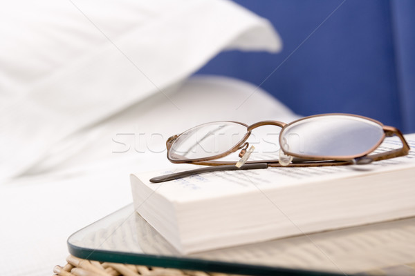Empty bedroom with focus on eyeglasses and book Stock photo © monkey_business