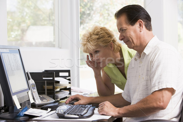 Couple in home office at computer frowning Stock photo © monkey_business