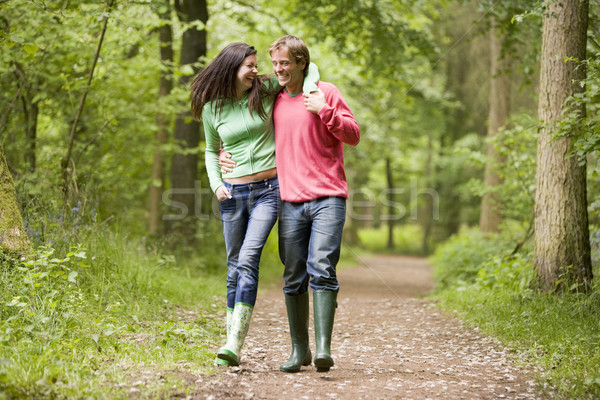 Stock photo: Couple walking on path arm in arm