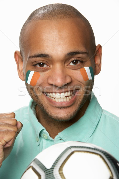 Young Male Football Fan With Ivory Coast Flag Painted On Face Stock photo © monkey_business