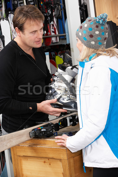 Sales Assistant Helping Advising Female Customer On Ski Boots In Stock photo © monkey_business