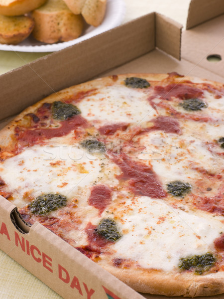 Cheese, Tomato And Pesto Pizza In A Take Away Box With Garlic Br Stock photo © monkey_business