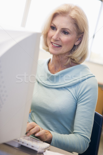 Mature female student learning computer skills Stock photo © monkey_business