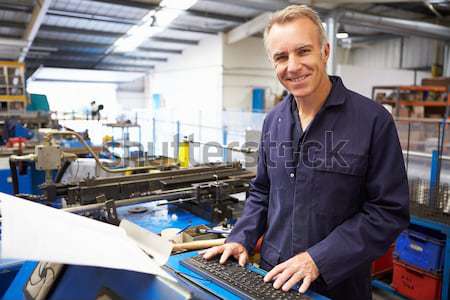 Machinist working on machine Stock photo © monkey_business