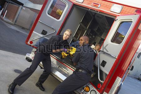 Paramedics and doctor unloading patient from ambulance Stock photo © monkey_business