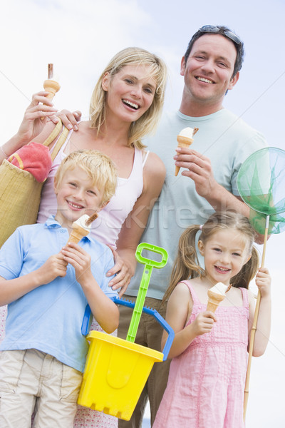 Family at beach with ice cream cones smiling Stock photo © monkey_business