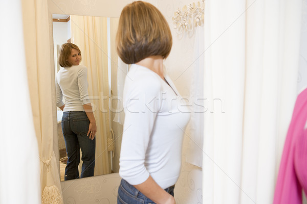 Woman trying on jeans and frowning Stock photo © monkey_business