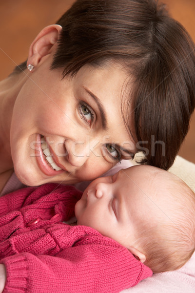 Stock photo: Portrait Of Mother With Newborn Baby At Home