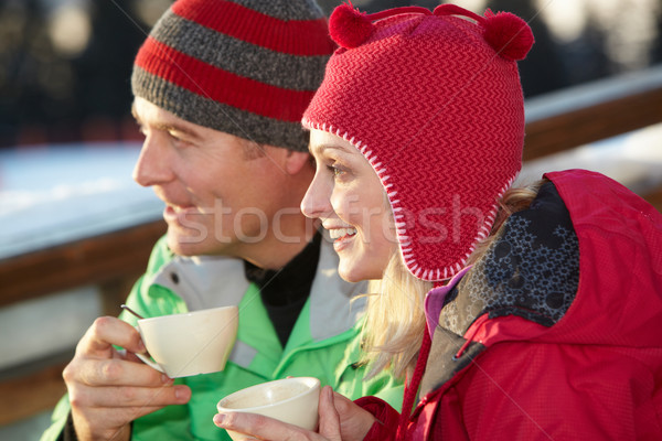 Casal bebida quente homem feliz neve Foto stock © monkey_business