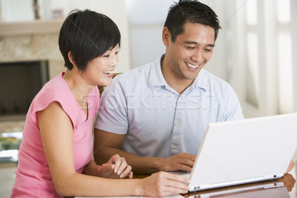 Paar eetkamer laptop glimlachend computer vrouw Stockfoto © monkey_business