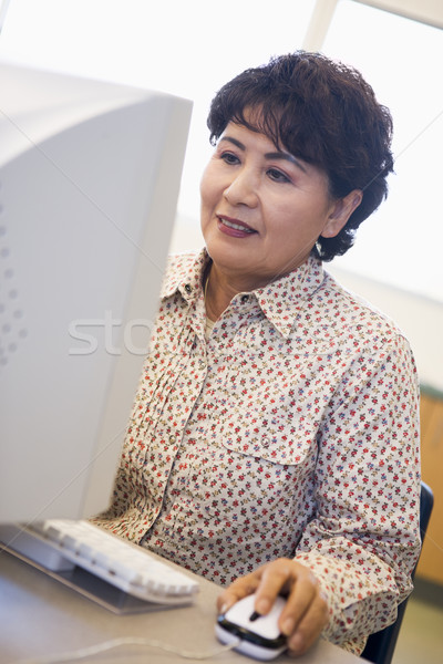 Mature female student learning computer skills Stock photo © monkey_business