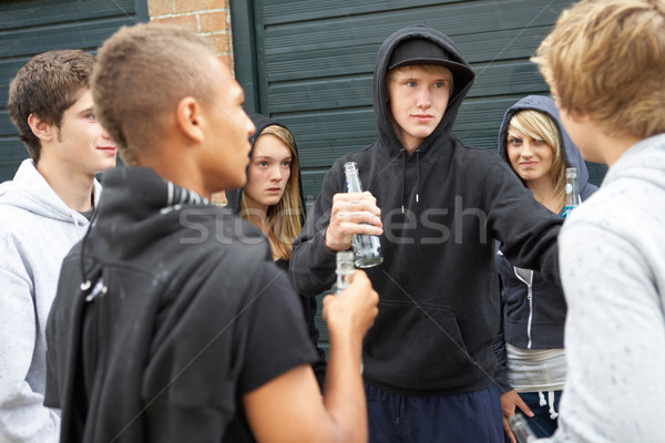 Group Of Threatening Teenagers Hanging Out Together Outside Drin Stock photo © monkey_business