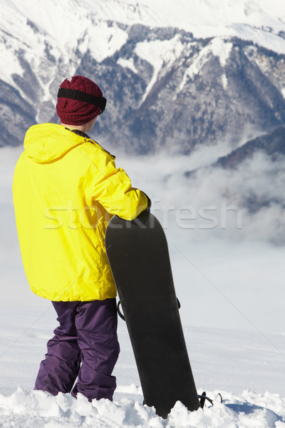 Teenage Snowboarder Admiring Mountain View Whilst On Ski Holiday Stock photo © monkey_business