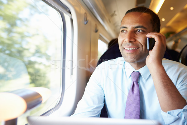 Stock foto: Geschäftsmann · Pendeln · Arbeit · Zug · Handy · Mann