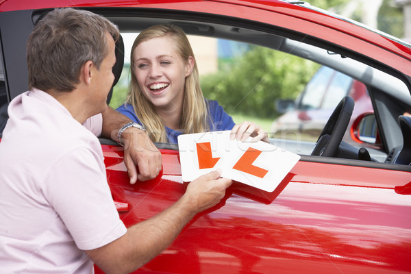 Teenage Girl Receiving Her Learner Plates Stock photo © monkey_business