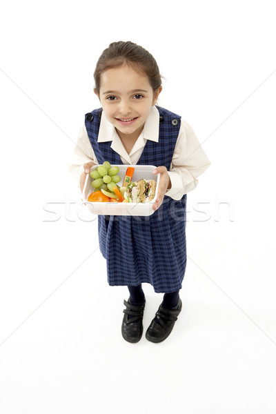 Studio Portrait of Smiling Girl Holding Lunchbox Stock photo © monkey_business