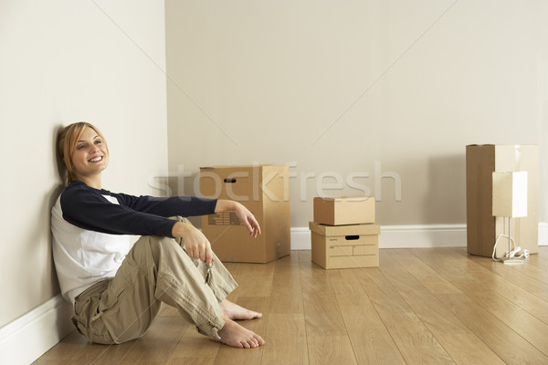 Stock photo: Young Woman Moving Into New Home
