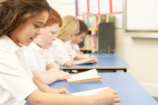 Group Of Children Reading Books In Classroom Stock photo © monkey_business