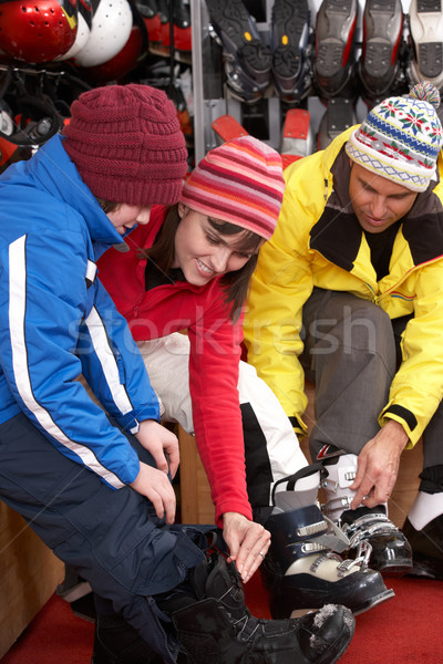 Family Trying On Ski Boots In Hire Shop Stock photo © monkey_business