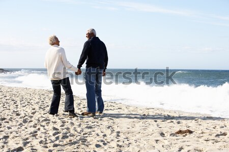 Senior Couple Walking Along Beach Together Stock photo © monkey_business
