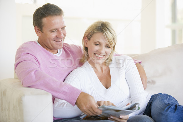 пару расслабляющая журнала улыбаясь человека счастливым Сток-фото © monkey_business