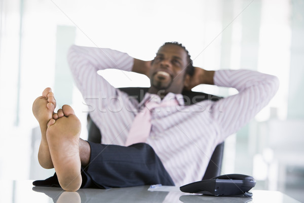 Geschäftsmann Sitzung Büro Fuß Schreibtisch entspannenden Stock foto © monkey_business