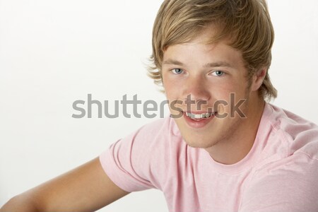 Joven sonriendo hombre estudio color caucásico Foto stock © monkey_business