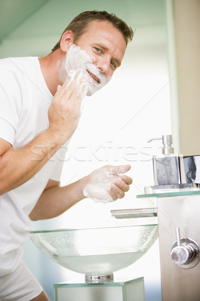 Man in bathroom shaving Stock photo © monkey_business