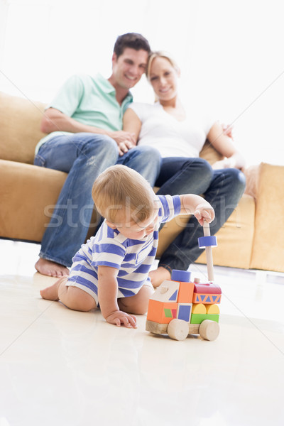 Casal sala de estar bebê sorridente homem casa Foto stock © monkey_business