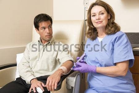 Stock photo: Nurse Giving Patient Injection Through Tube