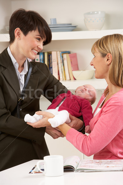 Working Mother Leaving Baby With Nanny Stock photo © monkey_business
