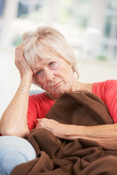 Sick, unhappy older woman at home Stock photo © monkey_business