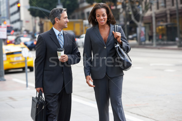 Businessman And Businesswoman In Street With Takeaway Coffee Stock photo © monkey_business