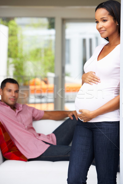 Stock photo: Expectant Couple Relaxing At Home Together