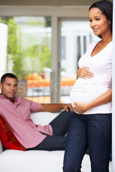 Expectante Pareja relajante casa junto mujeres Foto stock © monkey_business