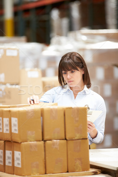 Worker In Warehouse Preparing Goods For Dispatch Stock photo © monkey_business