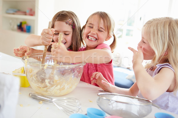 Three Girls Making Cupcakes In Kitchen Stock photo © monkey_business