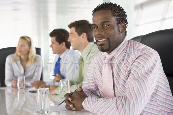Vier Geschäftsleute Sitzungssaal lächelnd glücklich Geschäftsleute Stock foto © monkey_business