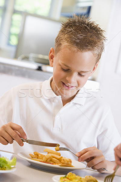 Schoolboy enjoying his lunch in a school cafeteria Stock photo © monkey_business