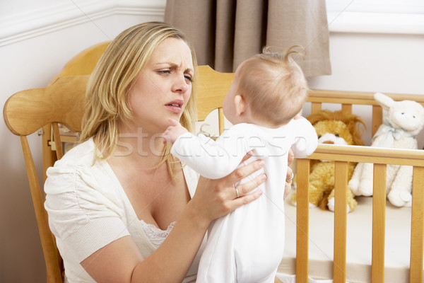 Stressed Mother Holding Baby In Nursery Stock photo © monkey_business
