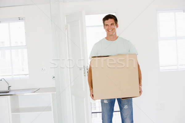 Om cutie în mişcare casa noua zâmbitor casă Imagine de stoc © monkey_business