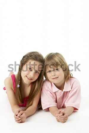 Two Children Laying on Stomach in Studio Stock photo © monkey_business