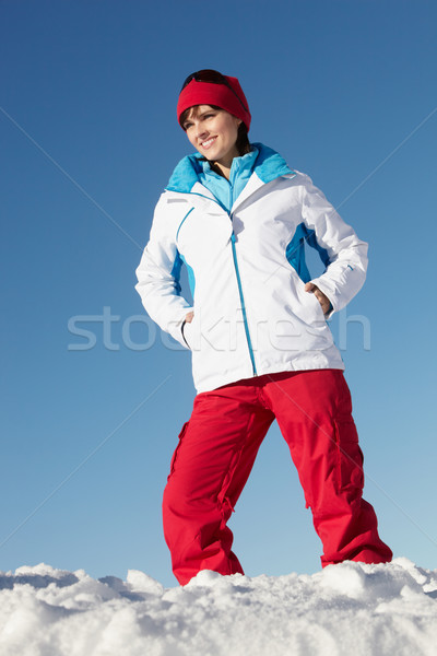 Woman Standing In Snow Wearing Warm Clothes On Ski Holiday In Mo Stock photo © monkey_business