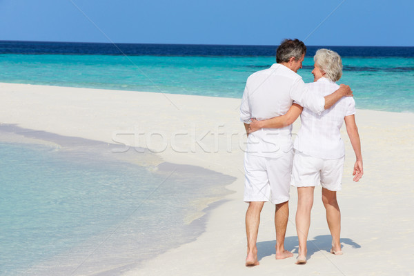 Senior Romantic Couple Walking On Beautiful Tropical Beach Stock photo © monkey_business