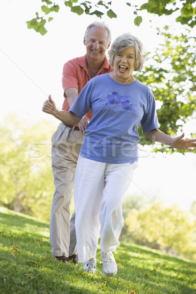 Stock photo: Senior couple having fun in park